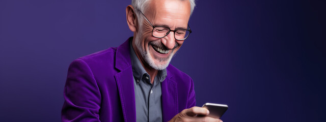 Sticker - An elderly man smiling and laughing with his phone against a colored background.