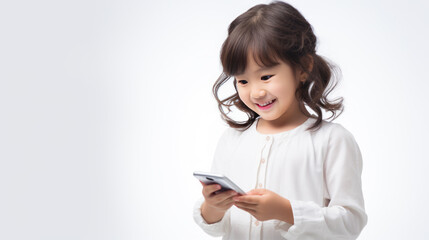 Canvas Print - Little smiling girl with a cell phone on a colored background.