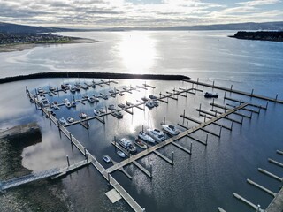 Canvas Print - Aerial view of Rhu Marina harbor on a sunny day, with various boats floating in the water