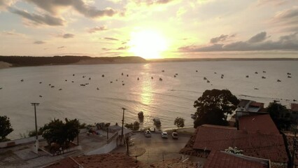 Canvas Print - Aerial view of coastline and silhouette of boats in the sea in Morro de Sao Paulo, Brazil at sunset