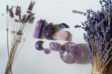 Wall Mural - Gemstones minerals stones and obelisks with lavender flowers.Witchcraft, herbal medicine and healing, Magic healing Rock for Reiki Crystal Ritual, Witchcraft, spiritual esoteric practice