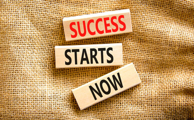 Wall Mural - Success starts now symbol. Concept word Success starts now on beautiful wooden block. Beautiful canvas table canvas background. Business motivational success starts now concept. Copy space.
