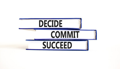 Wall Mural - Decide commit succeed symbol. Concept word Decide Commit Succeed on beautiful books. Beautiful white table white background. Business decide commit succeed concept. Copy space.