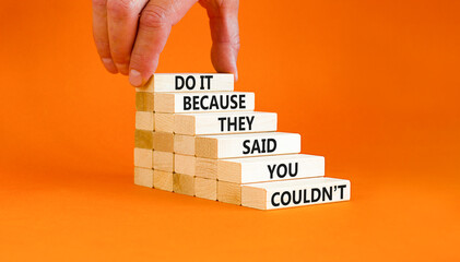 Wall Mural - You can do it symbol. Concept words Do it because they said you could not on wooden block. Beautiful orange table background. Businessman hand. Business, motivational you can do it concept. Copy space