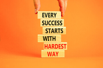 Wall Mural - Success symbol. Concept words Every success starts with hardest way on wooden block. Beautiful orange table orange background. Businessman hand. Business success and hardest way concept. Copy space.