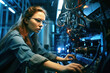 © Brynjar - Confident female worker skillfully operating high-tech machinery in a modern automotive manufacturing