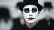 © ds17 - Young guy in a hat in a mime costume with a painted face outdoors