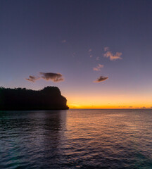 Canvas Print - Beautiful view of sunset with the silhouette of a cliff over the sea