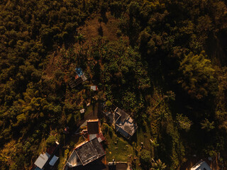 Wall Mural - Aerial view of a beautiful landscape with a few buildings in sunny weather