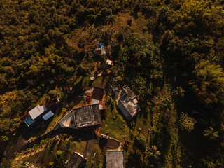 Wall Mural - Aerial view of a beautiful landscape with a few buildings in sunny weather