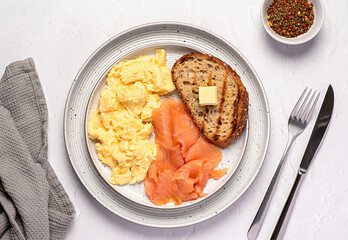 Wall Mural - Food photography of  breakfast; scrambled egg; brunch; omelette; smoked salmon; toast, wholegrain bread, seasoning