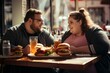 obesity and overeating two young obese people eat hamburger