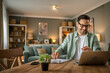 © Miljan Živković - one man adult caucasian work on laptop at home happy smile