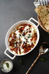 Wall Mural - Afghani Doi Begun - Eggplant prepared in tomato sauce topped with seasoned yogurt _ Baigan masala served with Roti