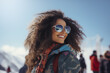 © ADDICTIVE STOCK - Generative AI portrait of happy African American woman in warm clothes and sunglasses looking away while standing against snowy mountains in winter