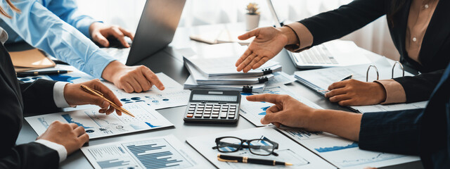 Auditor and accountant team working in office, analyze financial data and accounting record with calculator. Accounting company provide finance and taxation planning for profitable cash flow. Insight