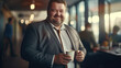 © EmmaStock - The chubby businessman with coffee