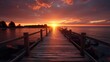 A wooden pier with a sunset in the background