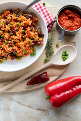 Wall Mural - Ajvar rice with kidney beans on a plate. Healthy zero waste meal