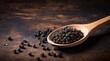 Black pepper in a wooden spoon isolated on black background