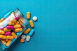 Glass Bottle of Pills is surrounded by a pile of colorful pills