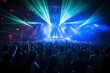 © Martin - music venue concert with large crowd light show and vibrant colors