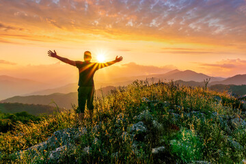 man doing hiking sport in mountains with anazing highland view