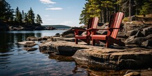 Two Red Muskoka Chairs Sitting On A Rock