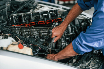 close up view. auto mechanic working in garage. repair service