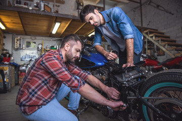 Guys at the motorbike repair shop