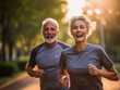 A senior couple in love smiling happily and energetically is jogging together in the park. with the concept of elderly people running and exercising for good health