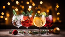 Glasses Of Cocktails With Christmas Decoration On Bokeh Lights Background