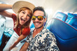 © Davide Angelini - Happy tourist taking selfie inside airplane - Cheerful couple on summer vacation - Passengers boarding on plane - Holidays and transportation concept