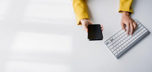 Wall Mural - Type search information from the Internet network. Businessman working with smartphone, tablet and laptop computer on table in office. network concept