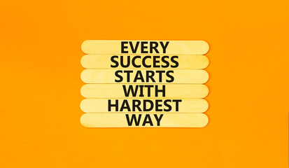 Wall Mural - Success symbol. Concept words Every success starts with hardest way on wooden stick. Beautiful orange table orange background. Business success and hardest way concept. Copy space.