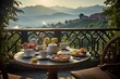 Breakfast with coffee and fresh pastries on the terrace overlooking the mountains
