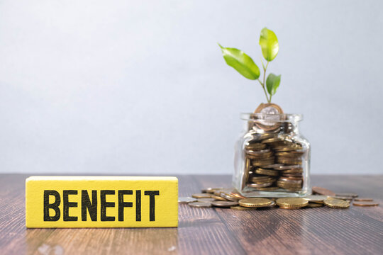 BENEFITS torn paper on a yellow notebook. potted plants.