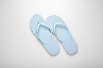 Sticker - Light blue flip flops on white background, top view