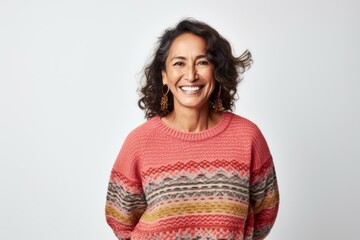 Canvas Print - Portrait photography of a cheerful Peruvian woman in her 50s wearing a cozy sweater against a white background