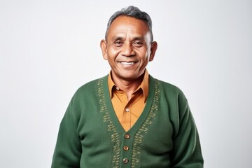 Wall Mural - Medium shot portrait photography of a Peruvian man in his 50s against a white background