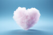 pink heart shaped cotton candy isolated on blue background