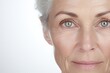 Close-up portrait of a stylish beautiful woman in her 60s. Eyes of an elderly woman looking at camera. Vision and concept of older people.