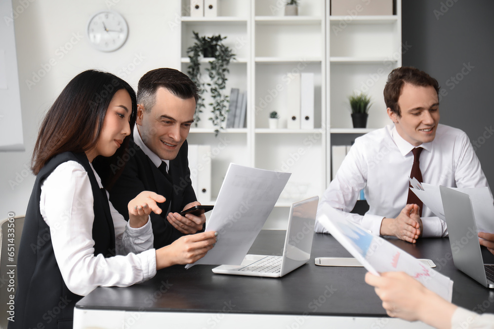 Group of business consultants working in office