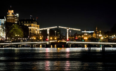 Wall Mural - Night Shot of the Famous Magere Brug, Crossing the River Amstel, Amsterdam, Holland