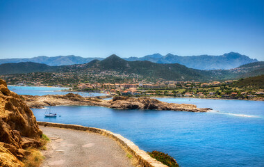 Wall Mural - View of the City of L'Ile Rousse on Corsica, France, as Seen from Ile de la Pietra