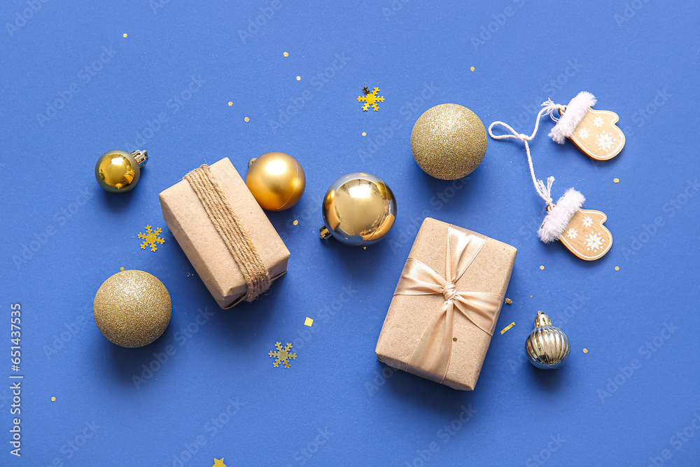 Christmas balls and gift boxes on blue background