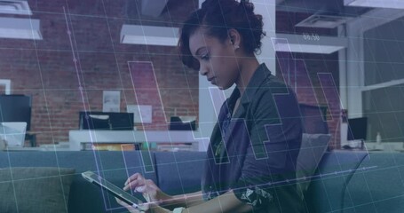 Poster - Animation of graph and grid pattern over biracial woman scrolling on digital tablet in office