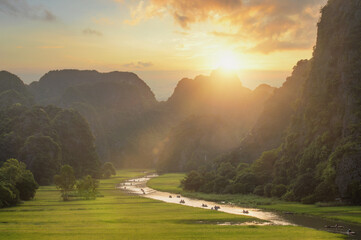 Wall Mural - Beautiful sunset landscape viewpoint from the top of Mua Cave mountain, Ninh Binh, Tam Coc in Vietnam