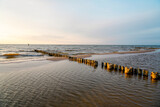 Fototapeta Krajobraz - Sunset on the Baltic Sea in Poland. Landscape in the evening with setting sun by the sea.