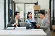 © laddawan - Creative managers crew working with new startup project in office. Asian Team brainstorming.